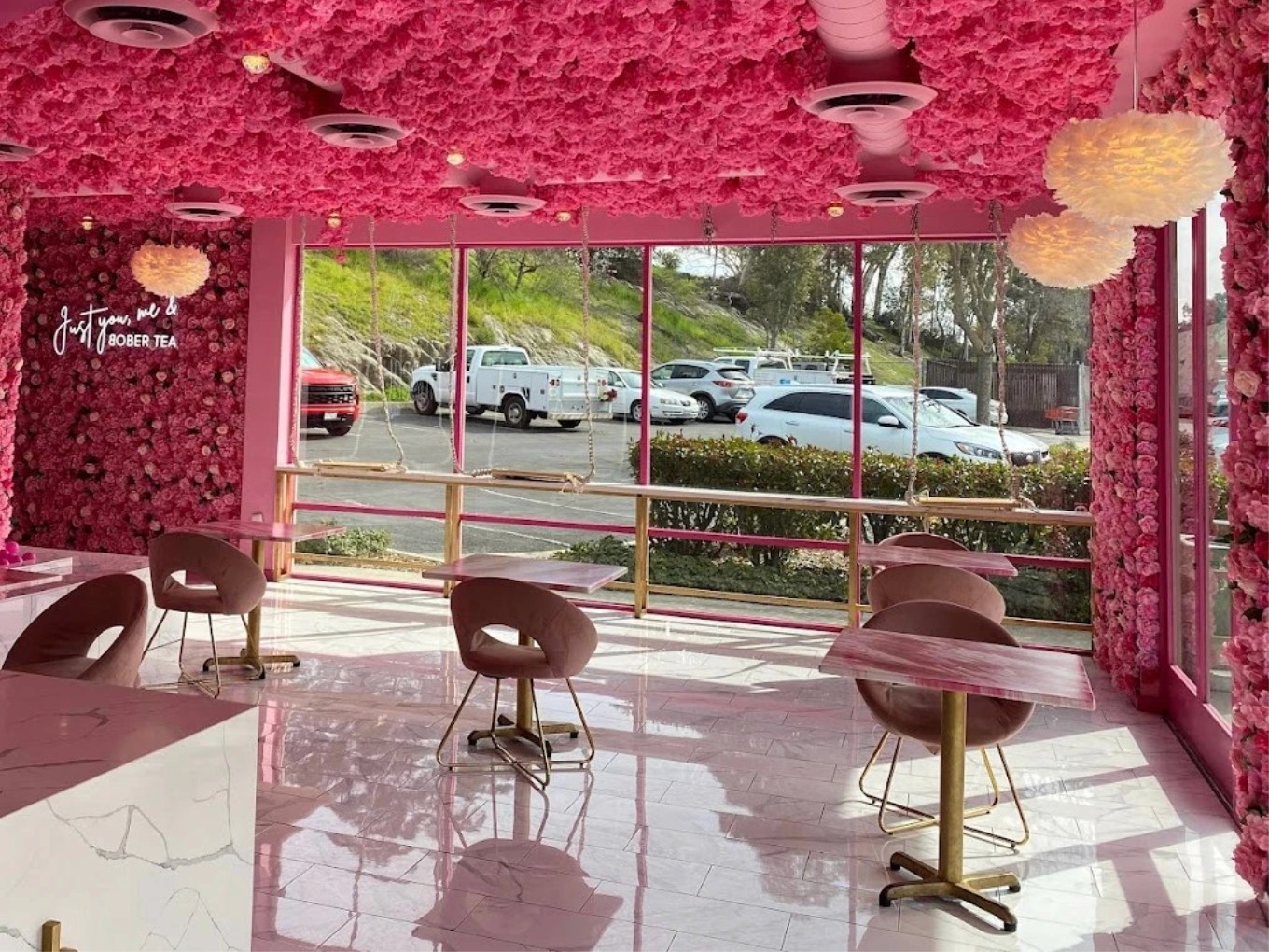 A flower-filled pink Bober Tea café interior